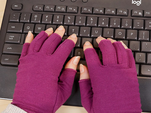 typing with Grace & Able compression gloves