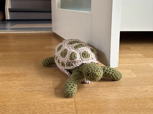 Anna's Tortoise Door Stopper, made from the PlanetJune Tortoise crochet pattern